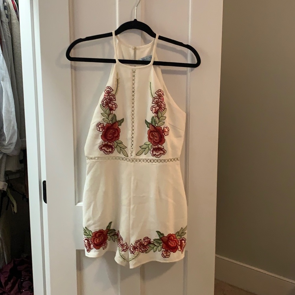 White romper with flower appliqués size S